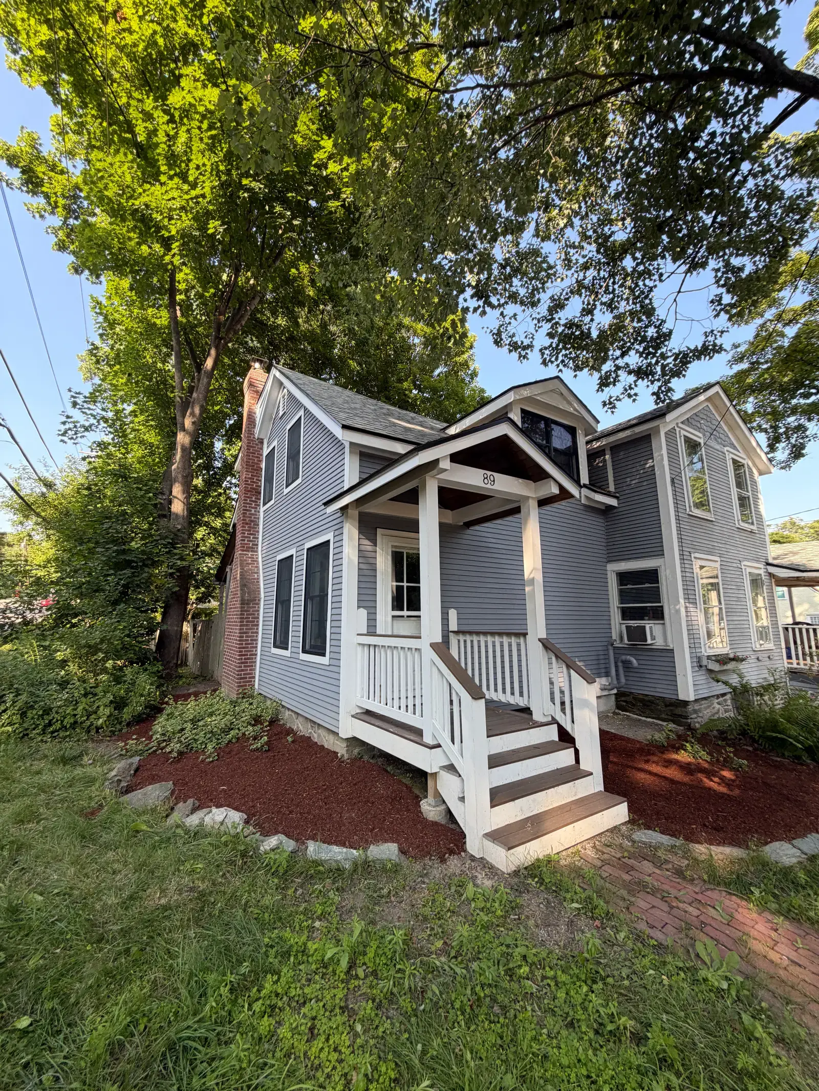 Front porch and mulched beds after a cleanup
