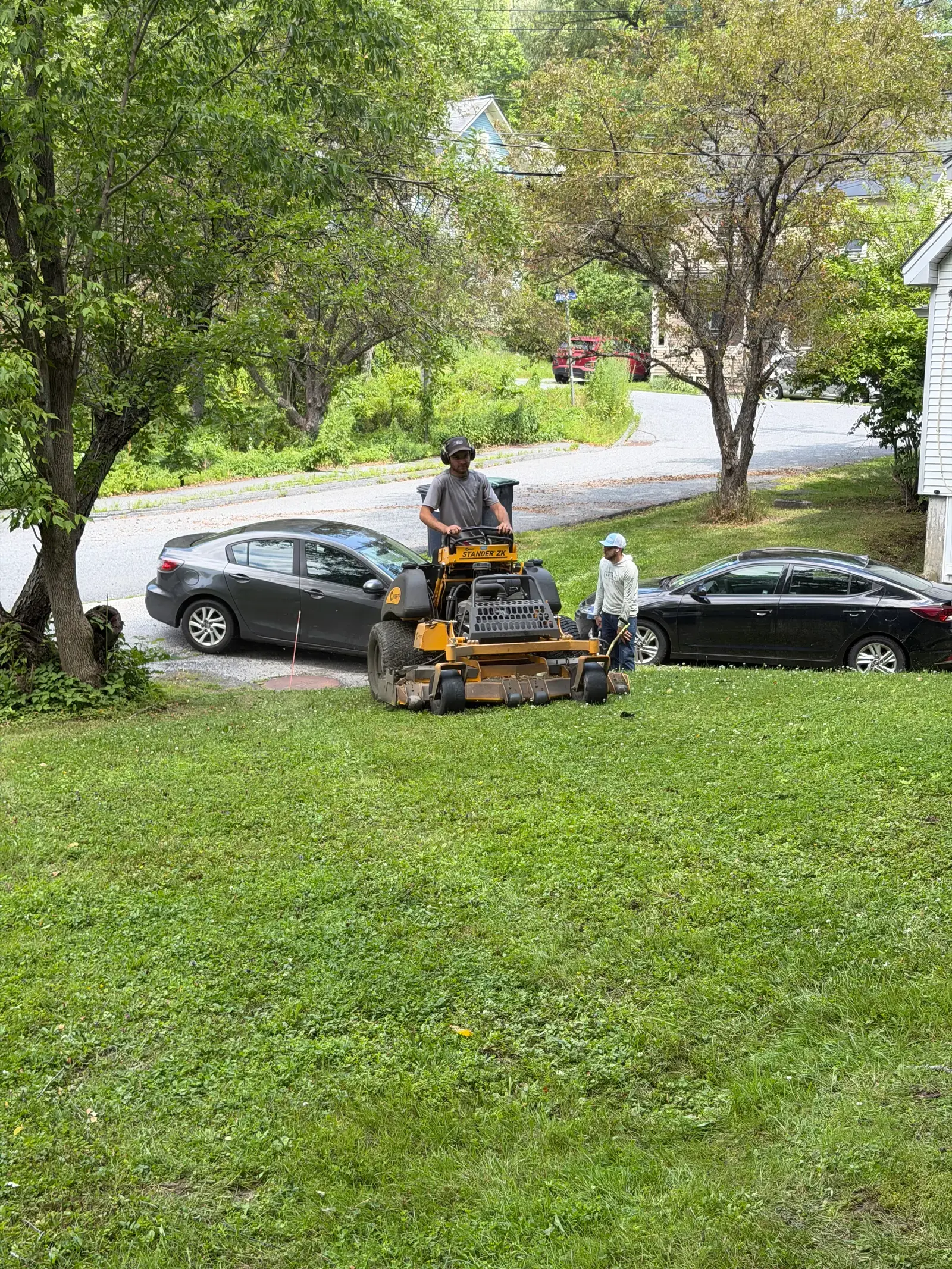 Mowing the street frontage of a village home